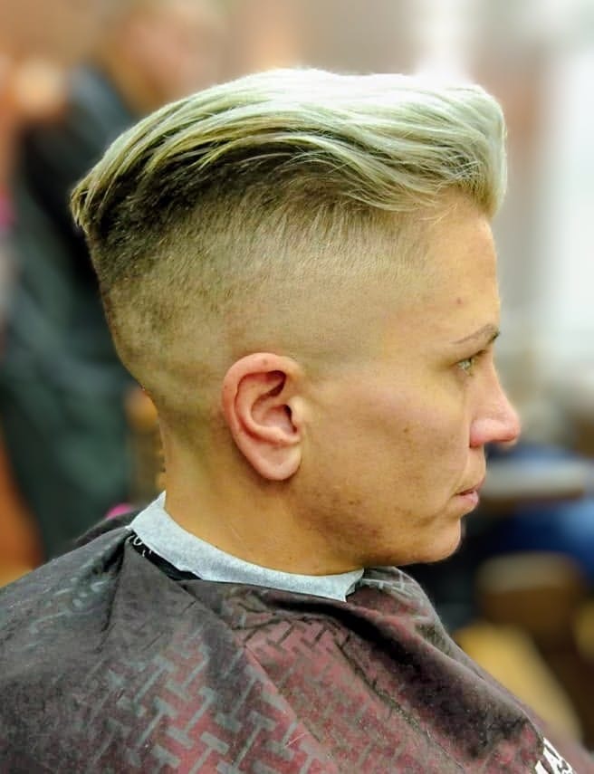Ladies blonde quiff — side profile showing skin fade