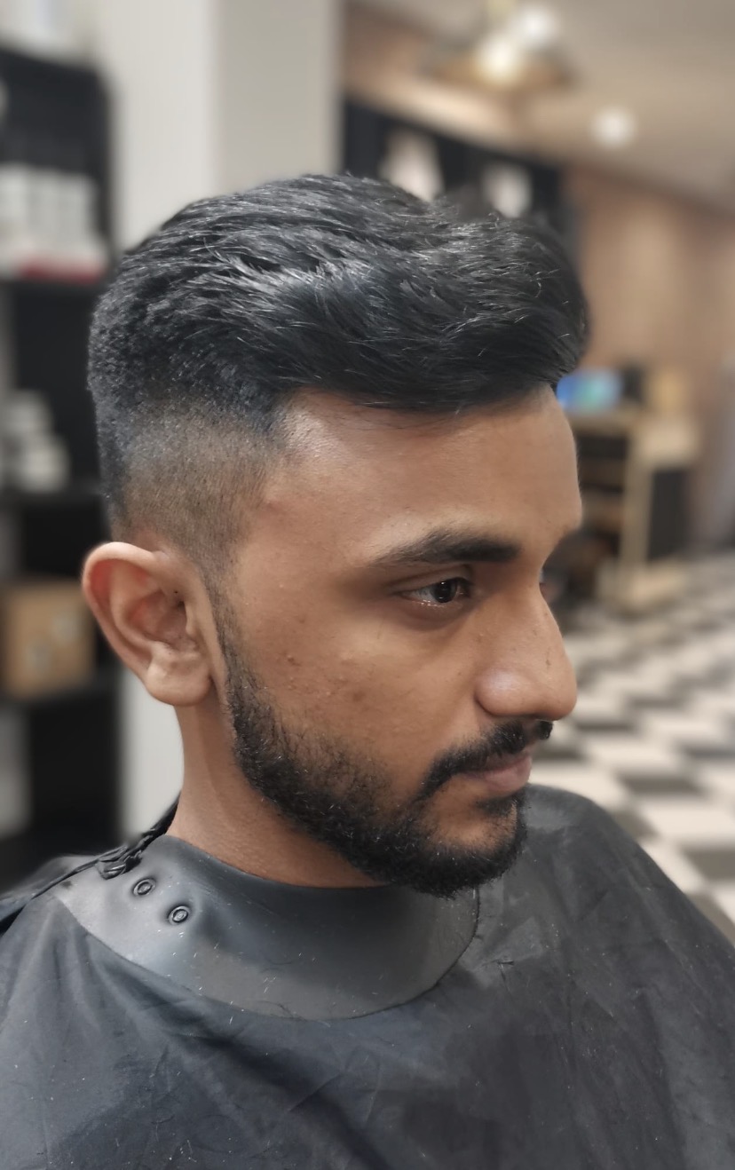 Textured quiff — Mid fade · Beard tidy