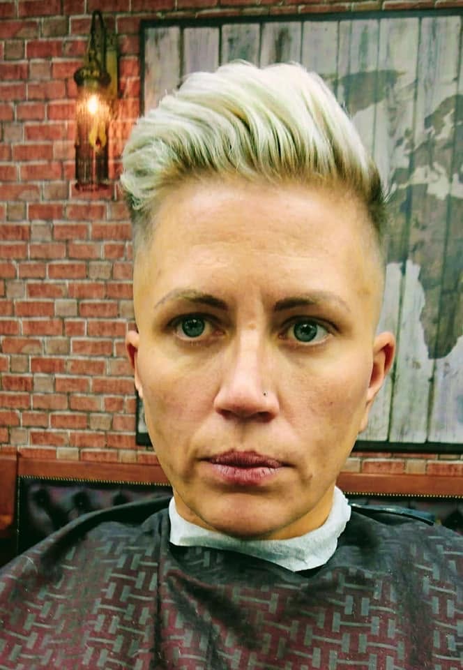 Ladies blonde quiff — front view with skin fade sides