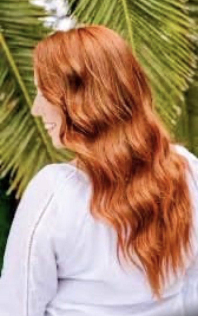 Long copper red hair with soft waves