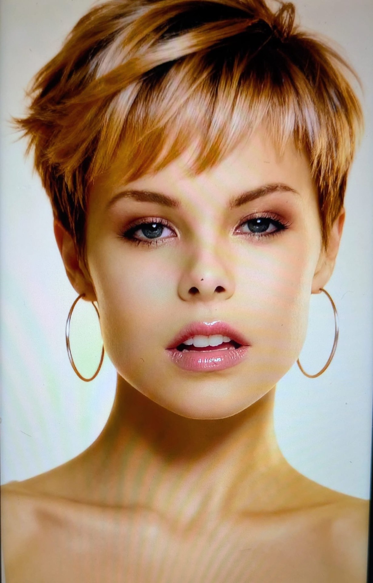 Ladies pixie cut with warm copper highlights and textured fringe